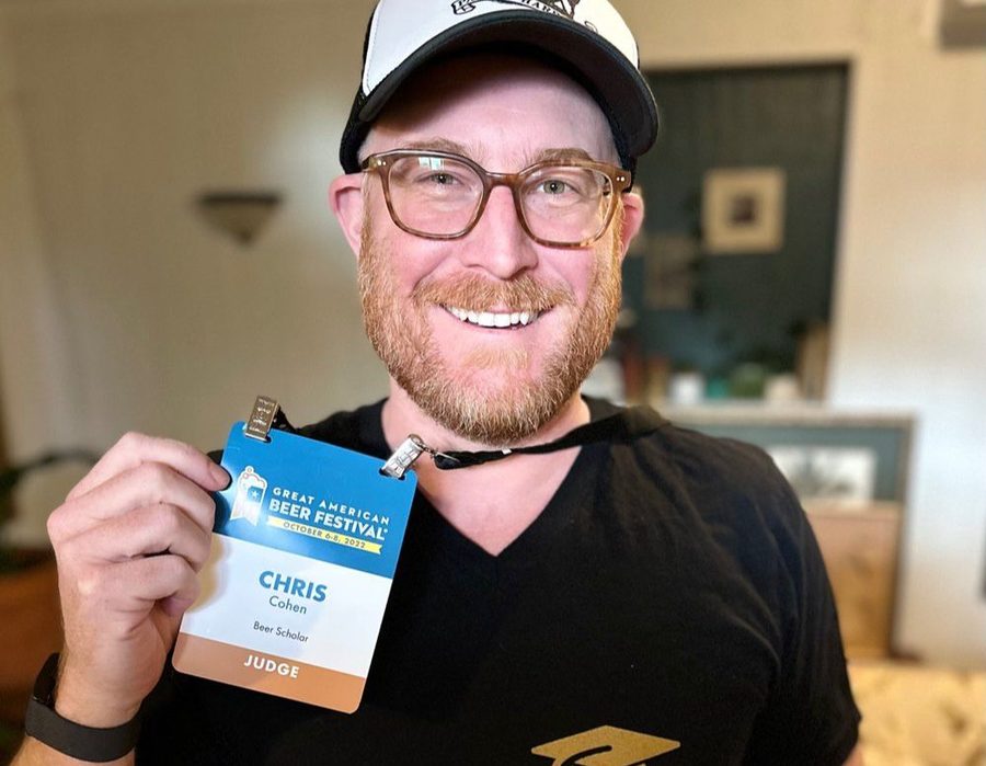 Chris Cohen holding his Great American Beer Festival judge badge